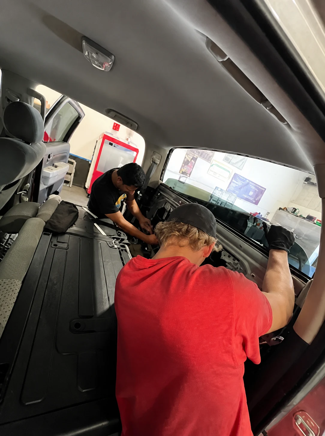 VanGo technicians working inside a vehicle