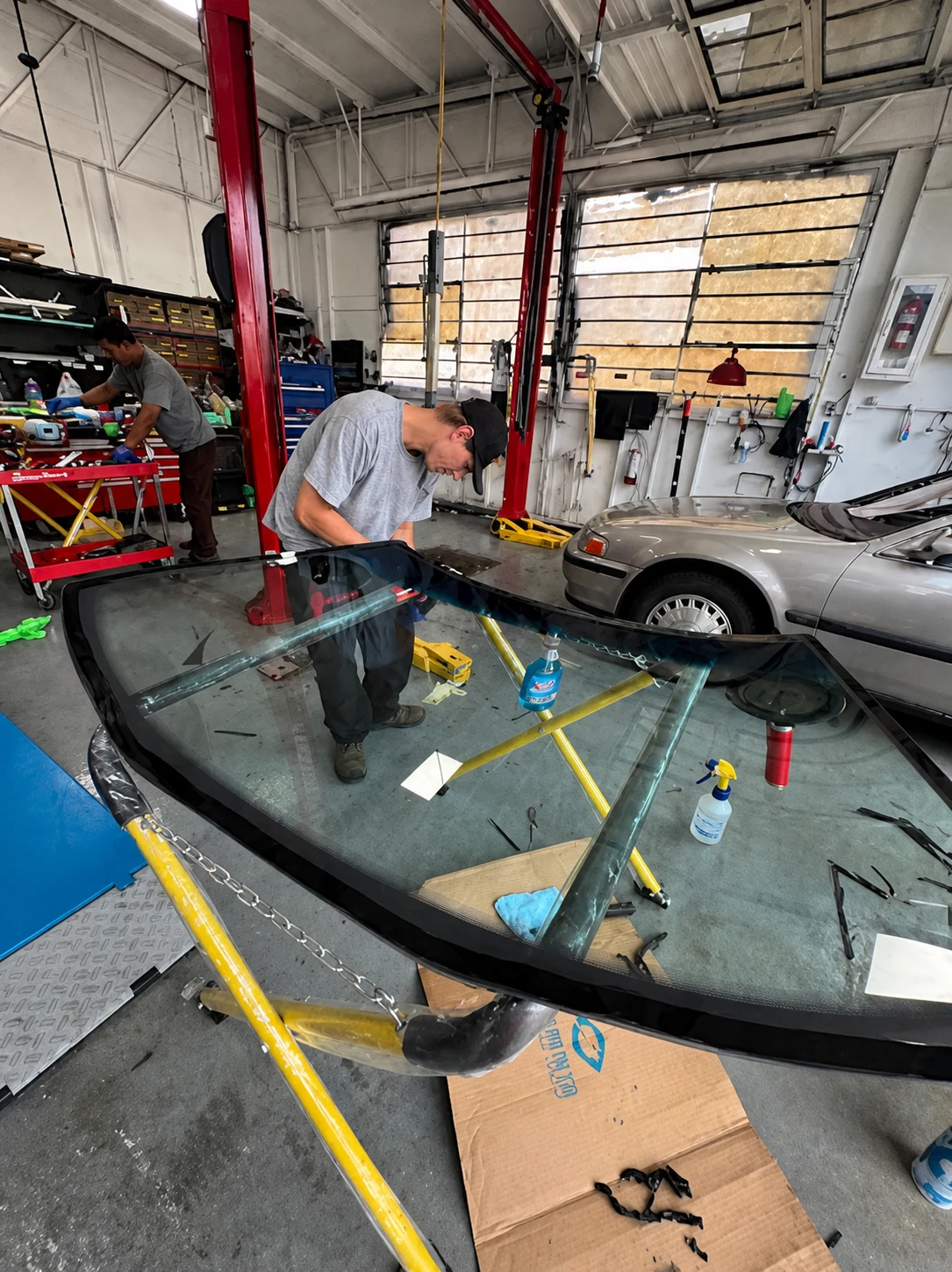VanGo technician preparing a windshield in the shop