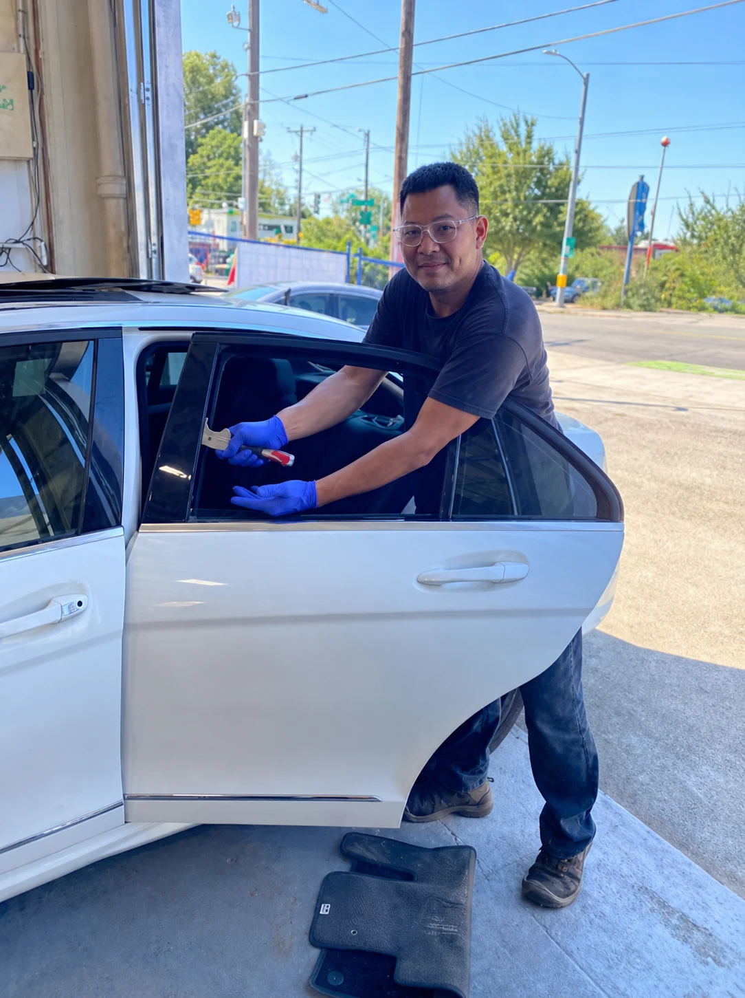 VanGo technician working on a windshield dashboard installation