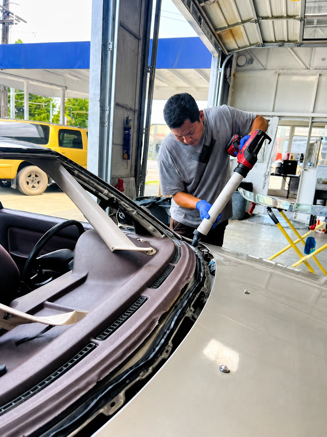 VanGo technician installing vehicle door glass